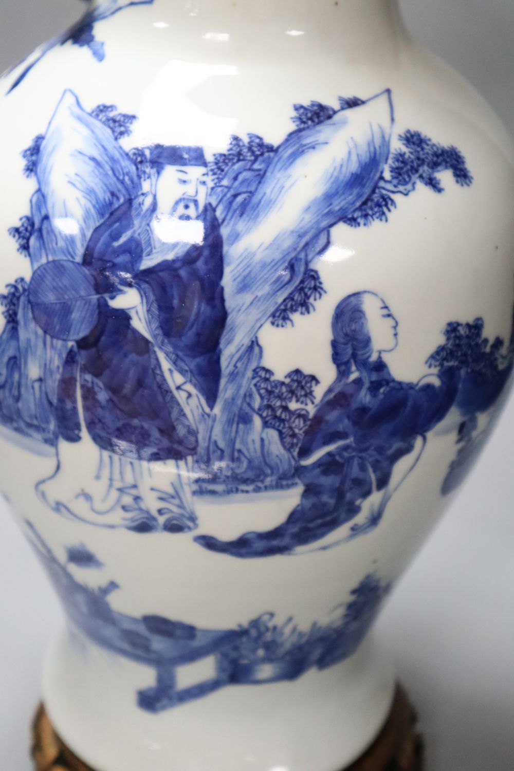 A 19th century Chinese porcelain blue and white vase and stand, neck sprigged with a serpent, on wood plinth, 49cm total height